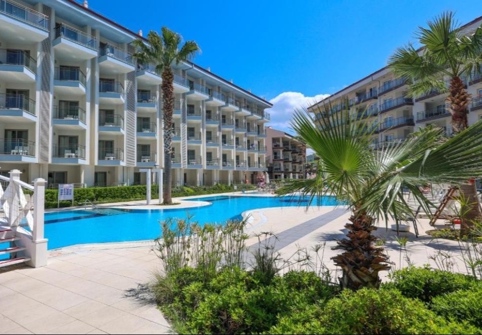 Почивка в Кушадасъ, Турция: 7 Аll Inclusive нощувки на човек в RAMADA HOTEL & SUITES BY WYNDHAM 5* + автобусен транспорт. Дете до 11.99 безплатно